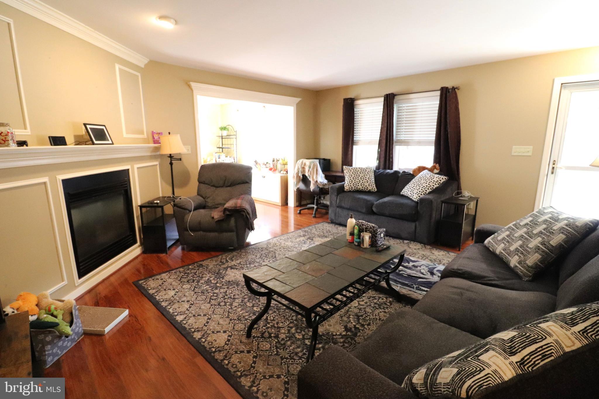 641 Chickadee Drive Lititz, PA 17543 - Photo 5 of 42 a living room with furniture window and a fireplace