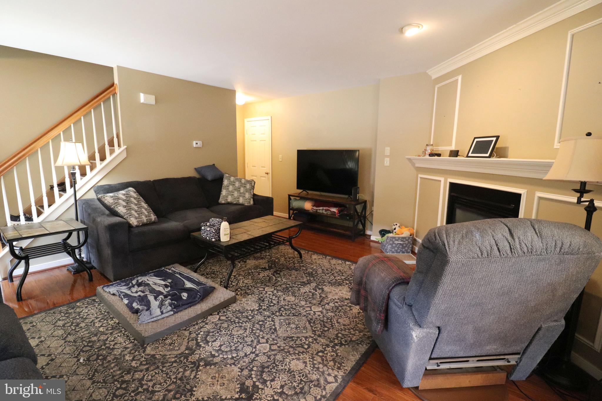 641 Chickadee Drive Lititz, PA 17543 - Photo 6 of 42 a living room with furniture and a fireplace