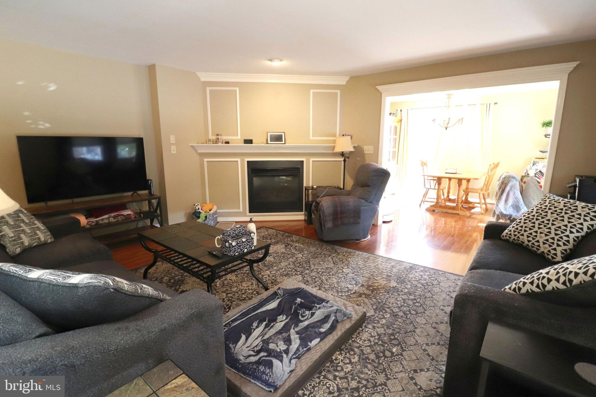 641 Chickadee Drive Lititz, PA 17543 - Photo 7 of 42 a living room with furniture and a flat screen tv