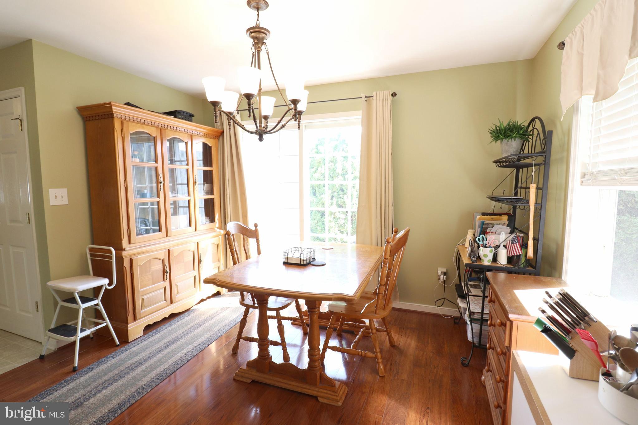 641 Chickadee Drive Lititz, PA 17543 - Photo 8 of 42 a view of a dining room with furniture window and wooden floor