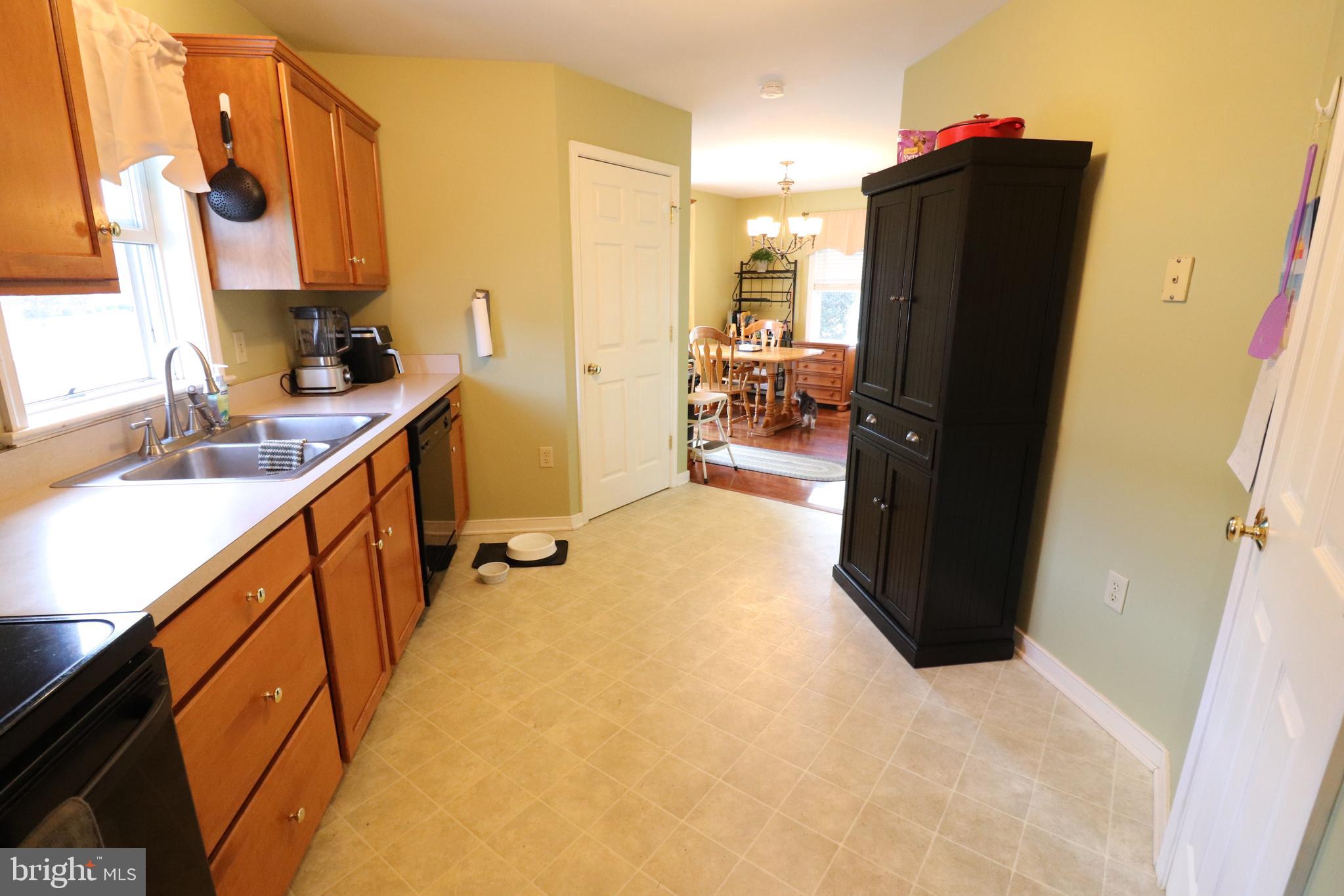641 Chickadee Drive Lititz, PA 17543 - Photo 10 of 42 a view of a kitchen with refrigerator and a sink