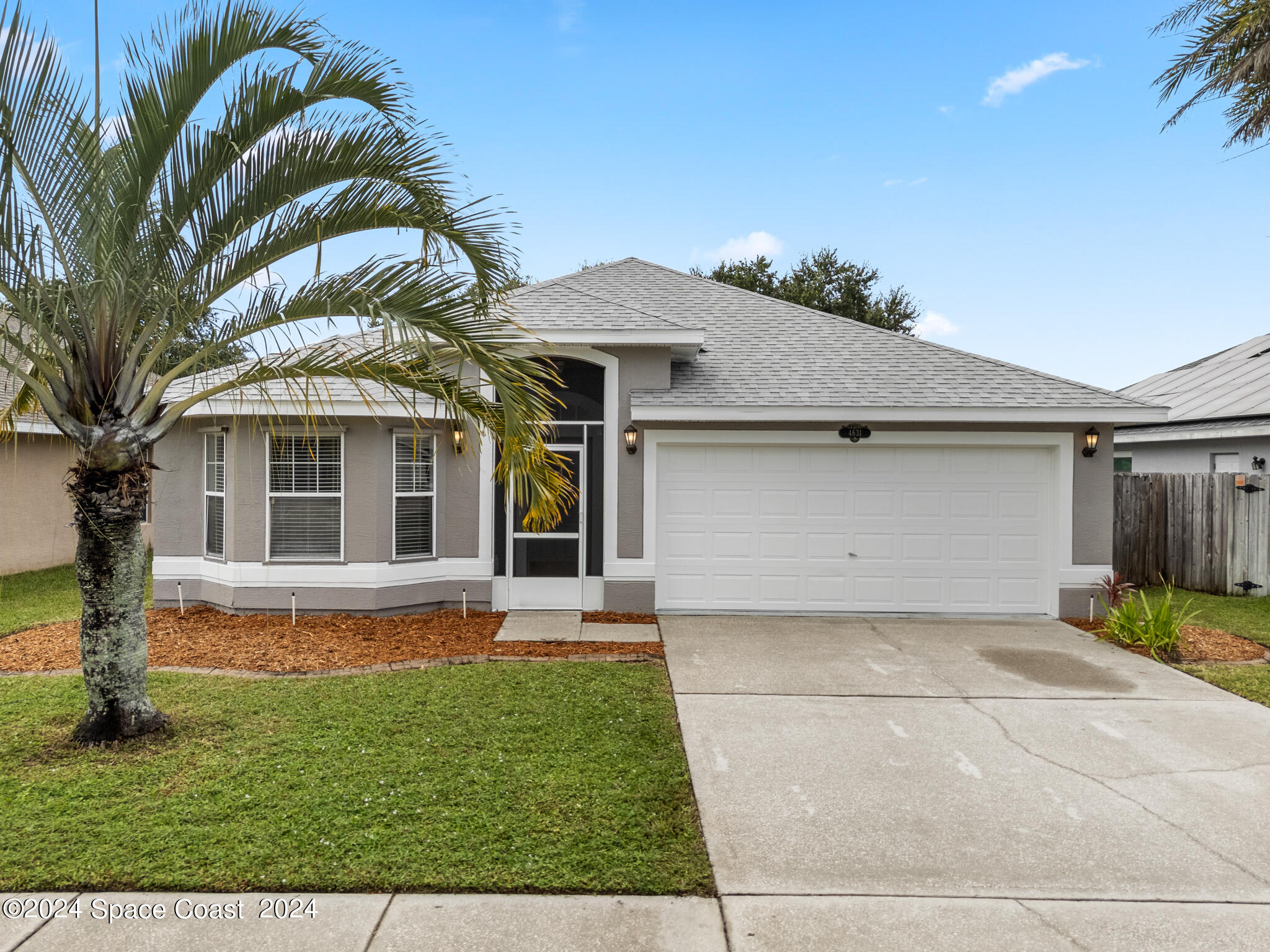 4631 Decatur Circle Melbourne, FL 32934 - Photo 1 of 35 front view of a house with a yard