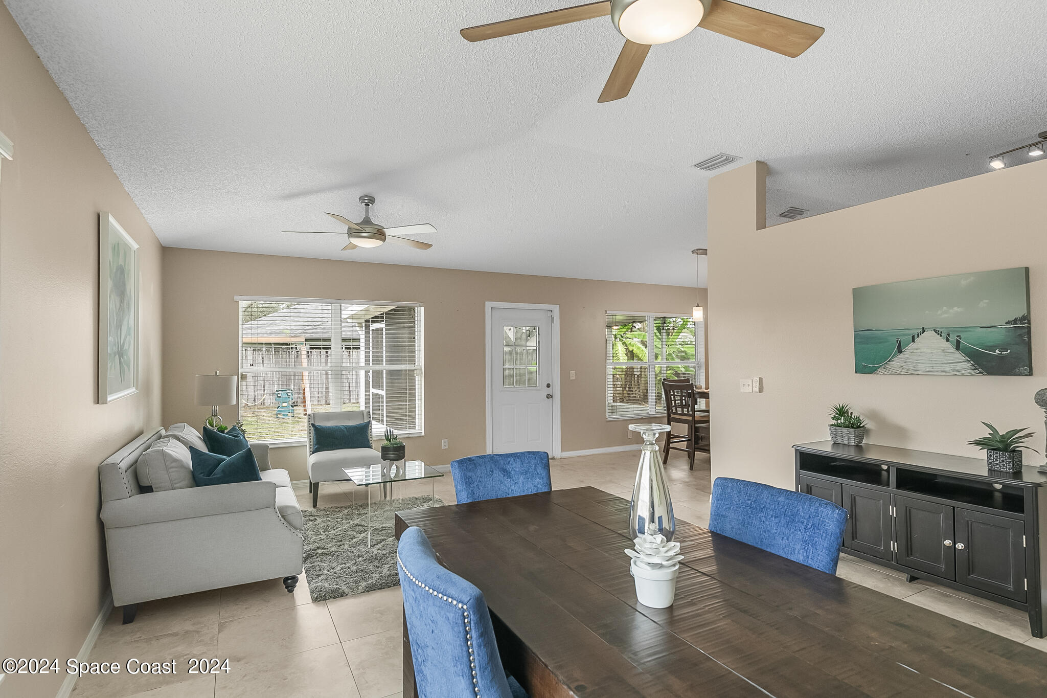 4631 Decatur Circle Melbourne, FL 32934 - Photo 11 of 35 a living room with furniture and a chandelier
