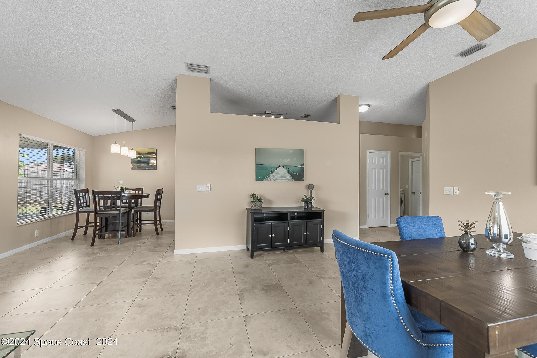 4631 Decatur Circle Melbourne, FL 32934 - Photo 12 of 35 a living room with furniture and view of kitchen