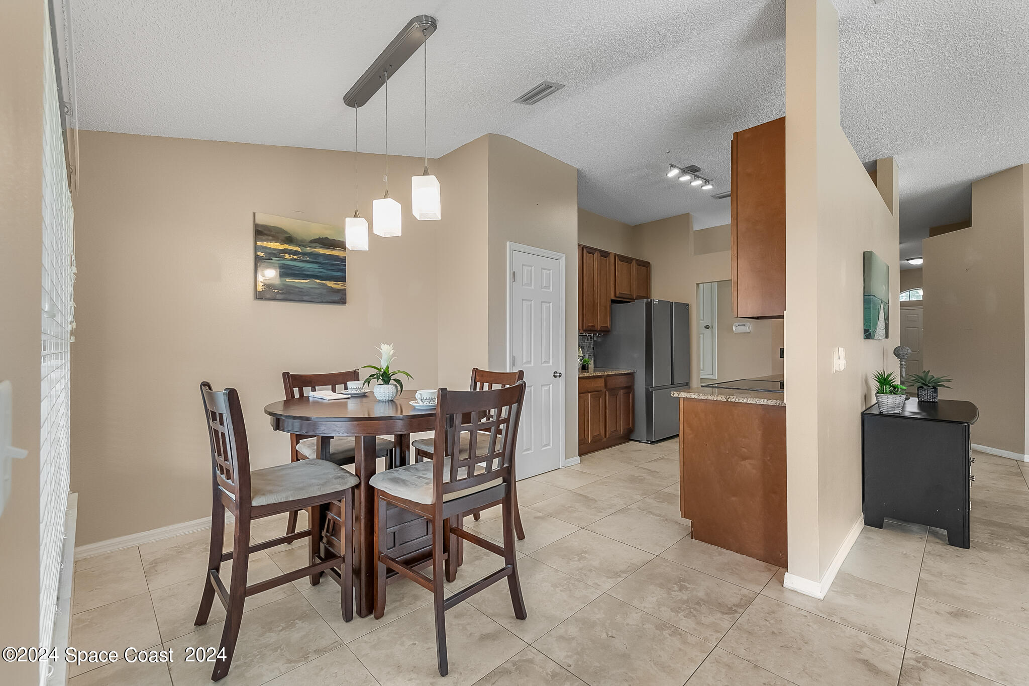 4631 Decatur Circle Melbourne, FL 32934 - Photo 13 of 35 a view of a dining room with furniture