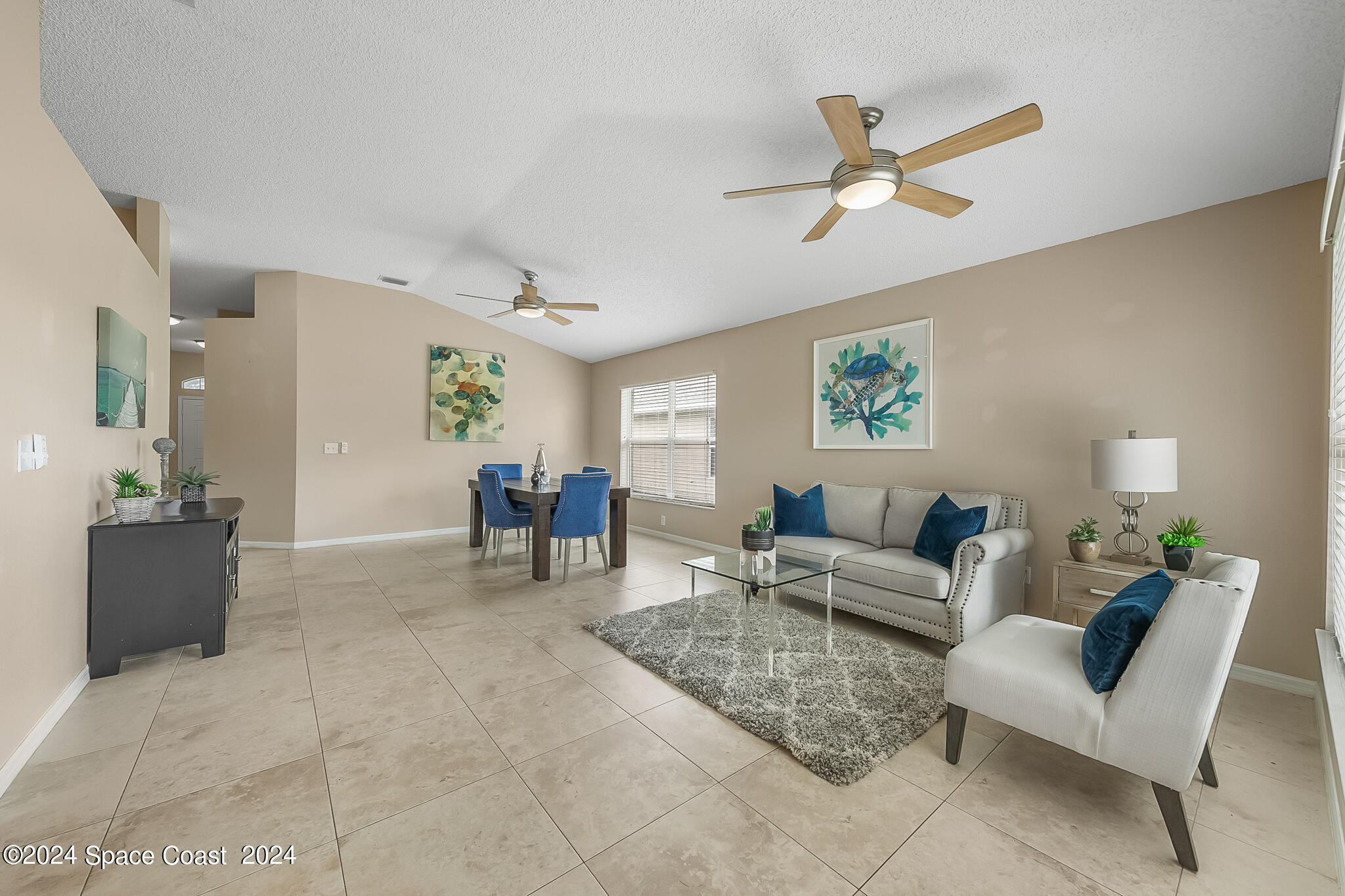 4631 Decatur Circle Melbourne, FL 32934 - Photo 14 of 35 a living room with furniture and a view of kitchen