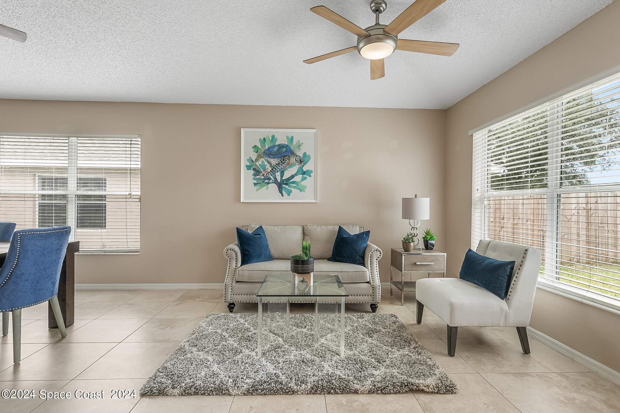 4631 Decatur Circle Melbourne, FL 32934 - Photo 16 of 35 a living room with furniture and a rug