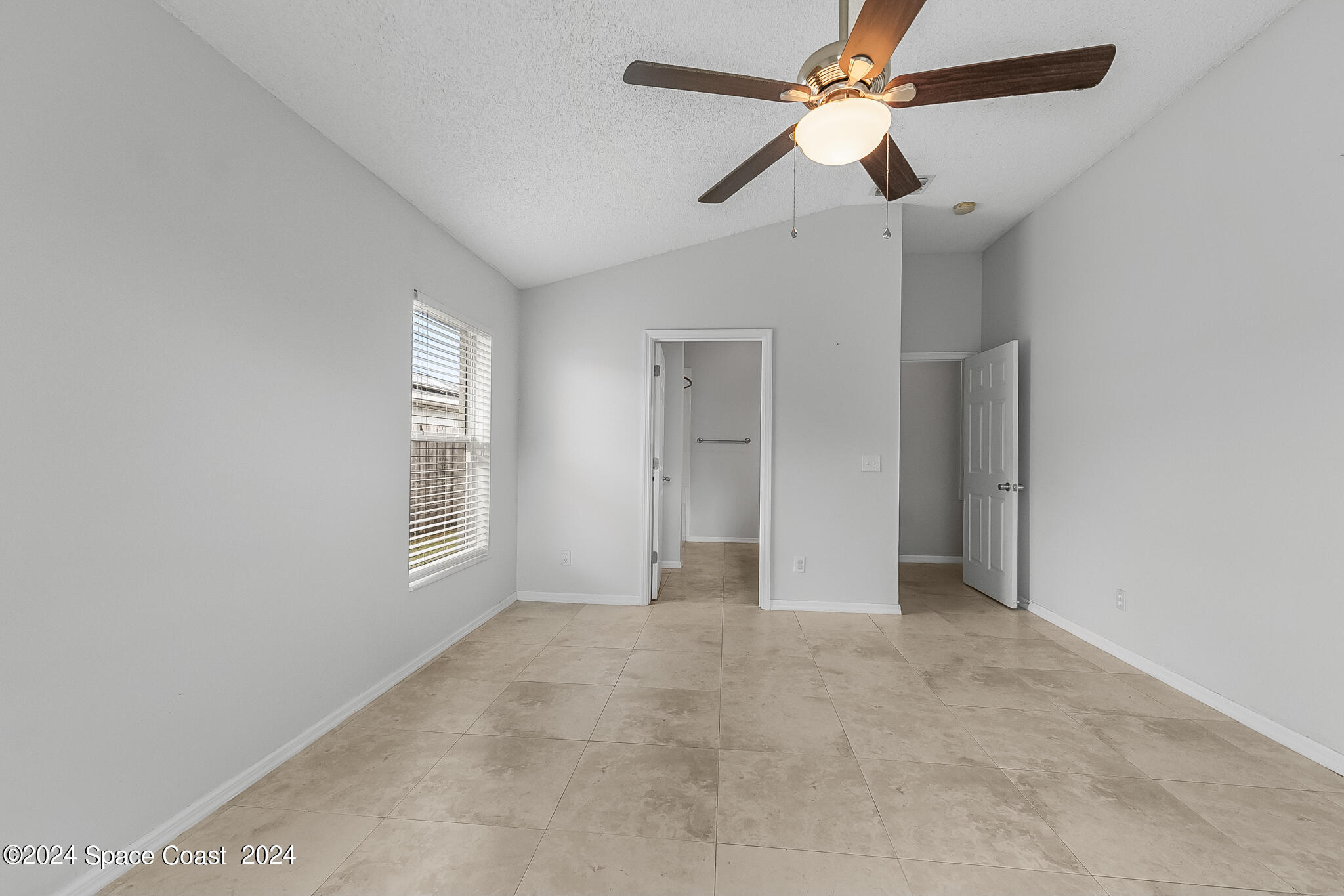 4631 Decatur Circle Melbourne, FL 32934 - Photo 20 of 35 a view of an empty room with a window