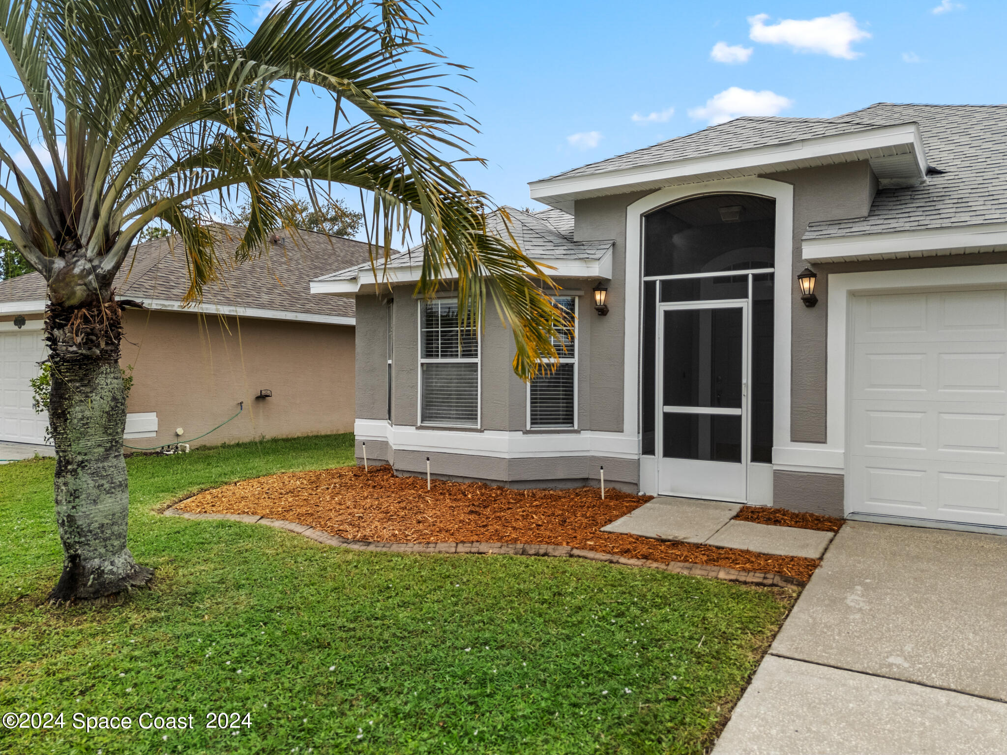4631 Decatur Circle Melbourne, FL 32934 - Photo 2 of 35 a view of a house with a yard