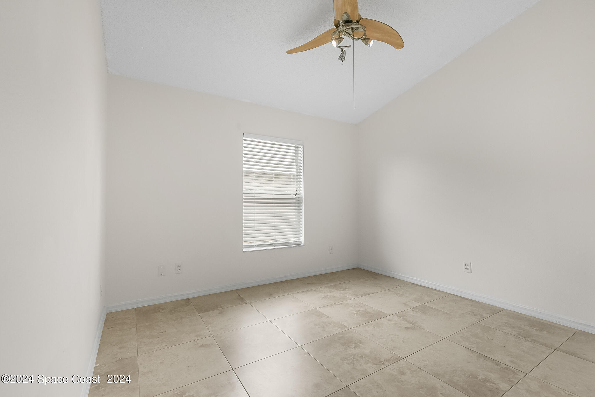 4631 Decatur Circle Melbourne, FL 32934 - Photo 25 of 35 an empty room with windows