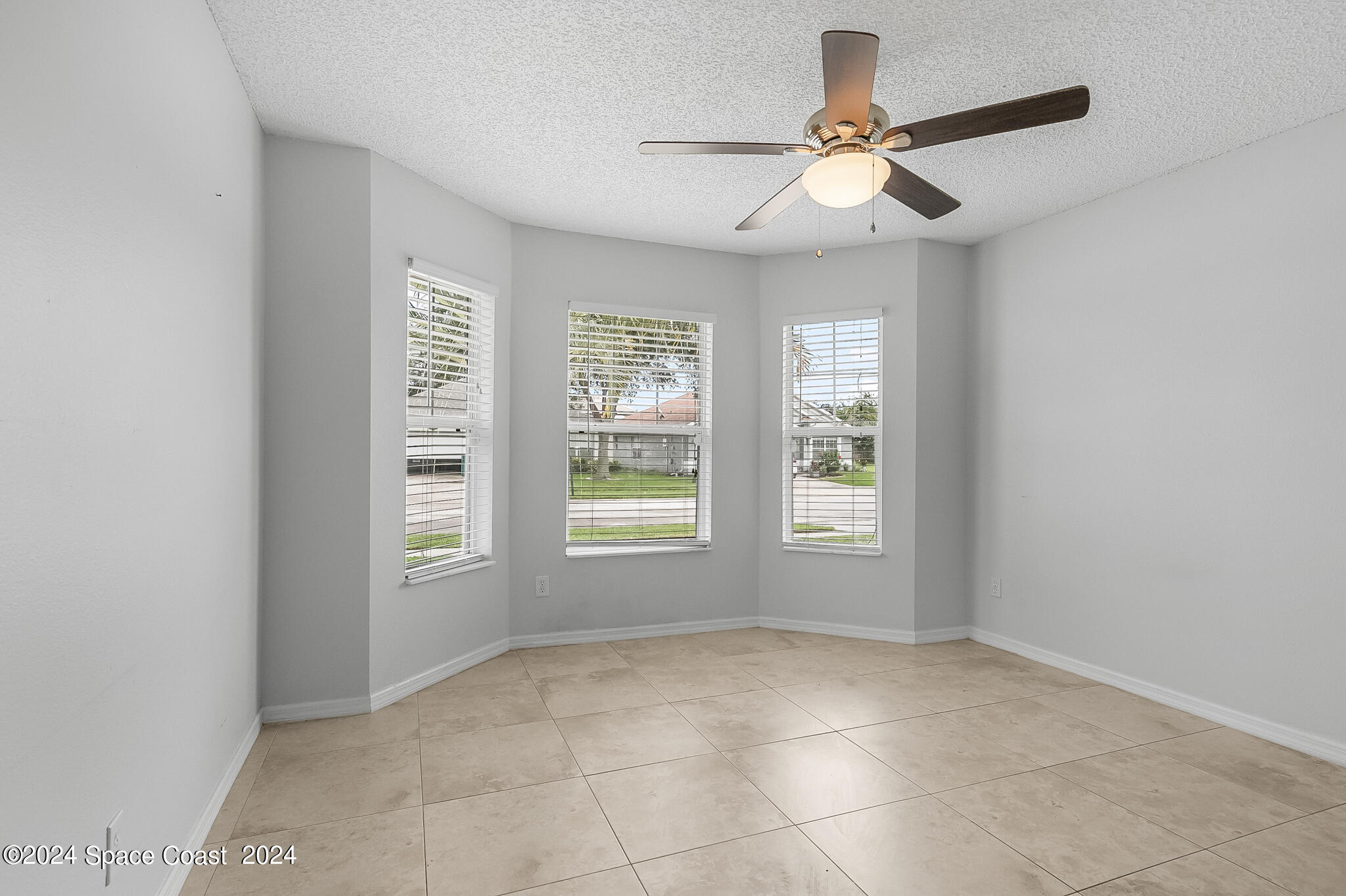4631 Decatur Circle Melbourne, FL 32934 - Photo 26 of 35 a view of an empty room with a window