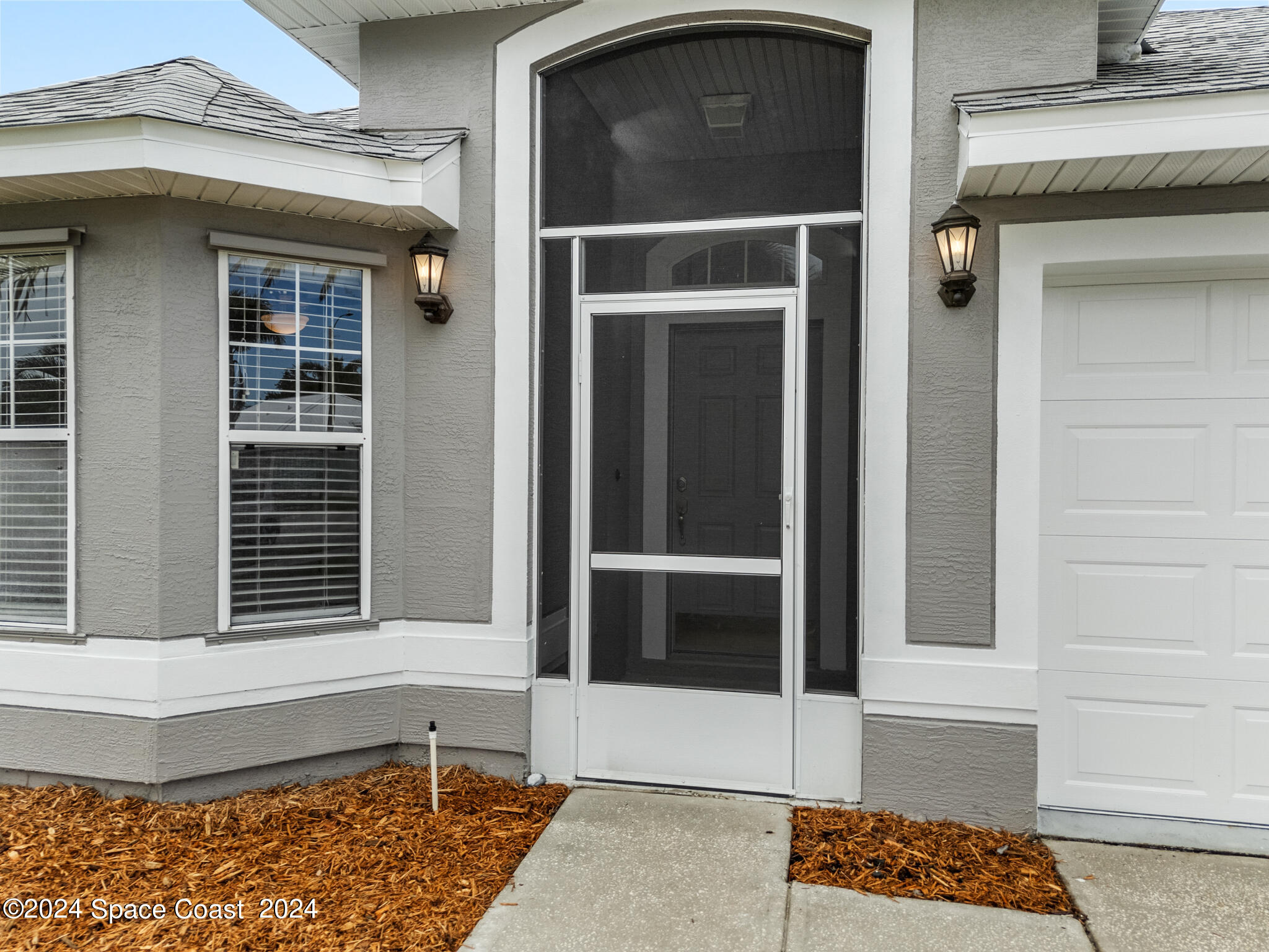4631 Decatur Circle Melbourne, FL 32934 - Photo 3 of 35 a view of a door of a house with a window