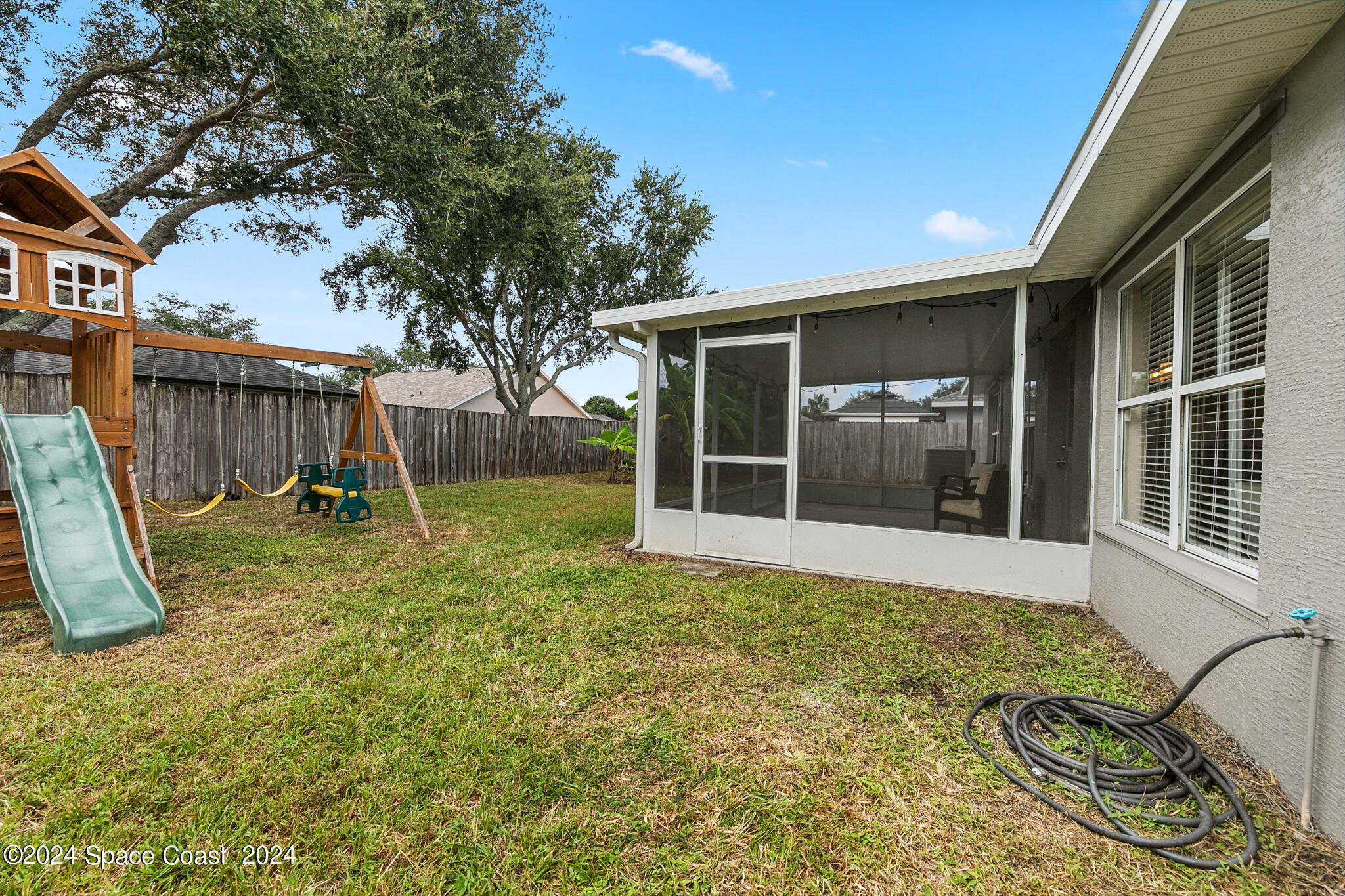 4631 Decatur Circle Melbourne, FL 32934 - Photo 32 of 35 a view of a house with backyard and a tree