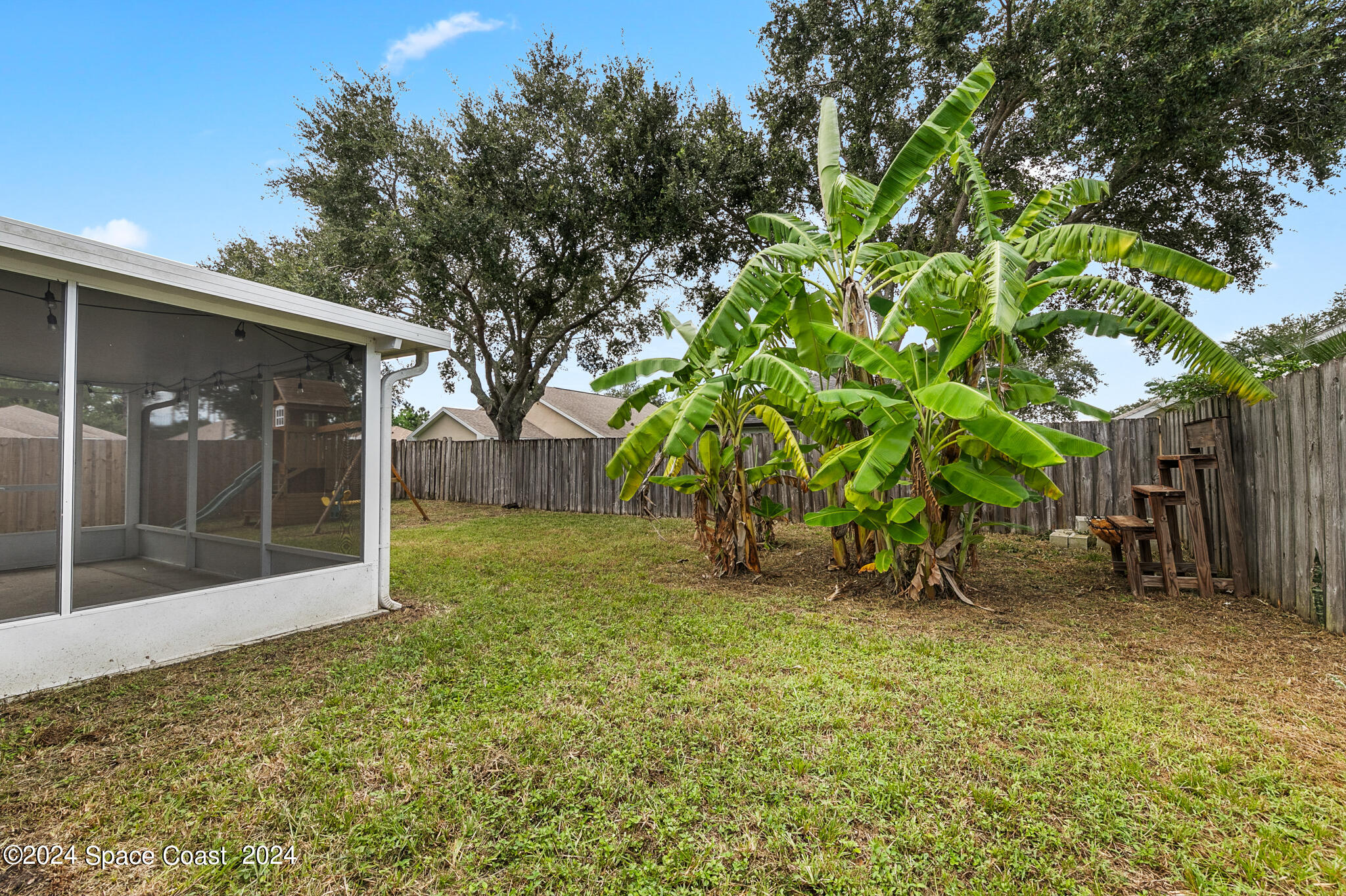 4631 Decatur Circle Melbourne, FL 32934 - Photo 33 of 35 a view of a backyard with a tree