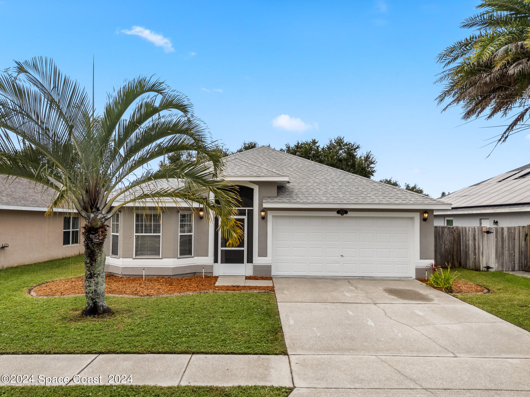 4631 Decatur Circle Melbourne, FL 32934 - Photo 35 of 35 a front view of a house with a garden