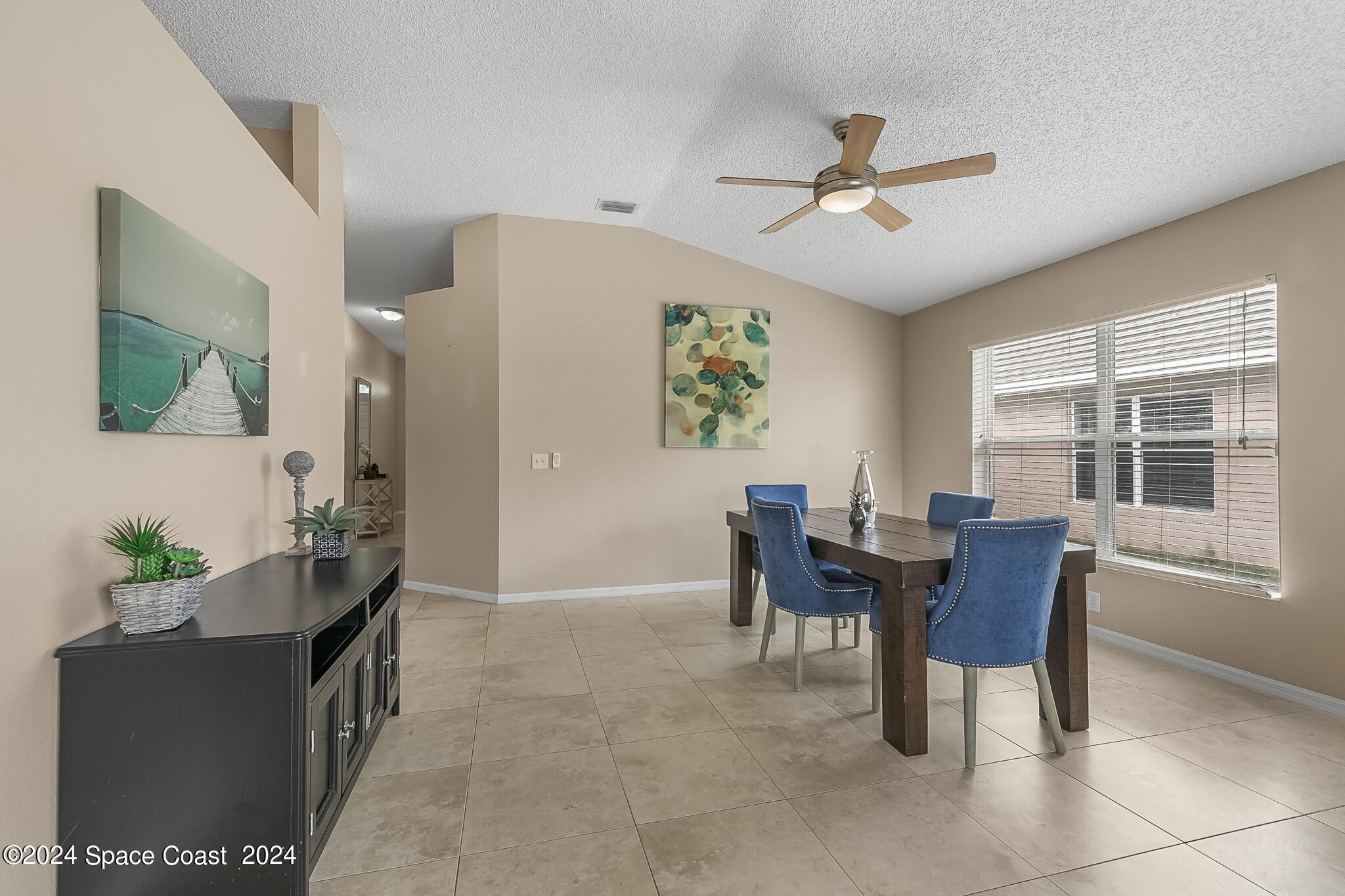 4631 Decatur Circle Melbourne, FL 32934 - Photo 8 of 35 a dining room with furniture and window