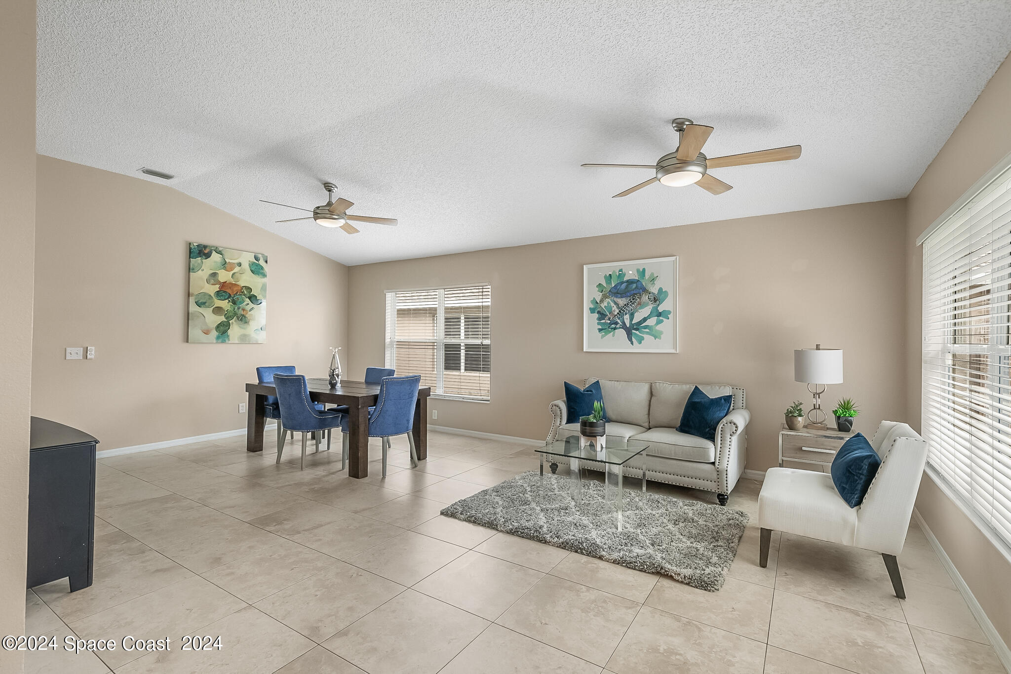 4631 Decatur Circle Melbourne, FL 32934 - Photo 9 of 35 a living room with furniture and a large window
