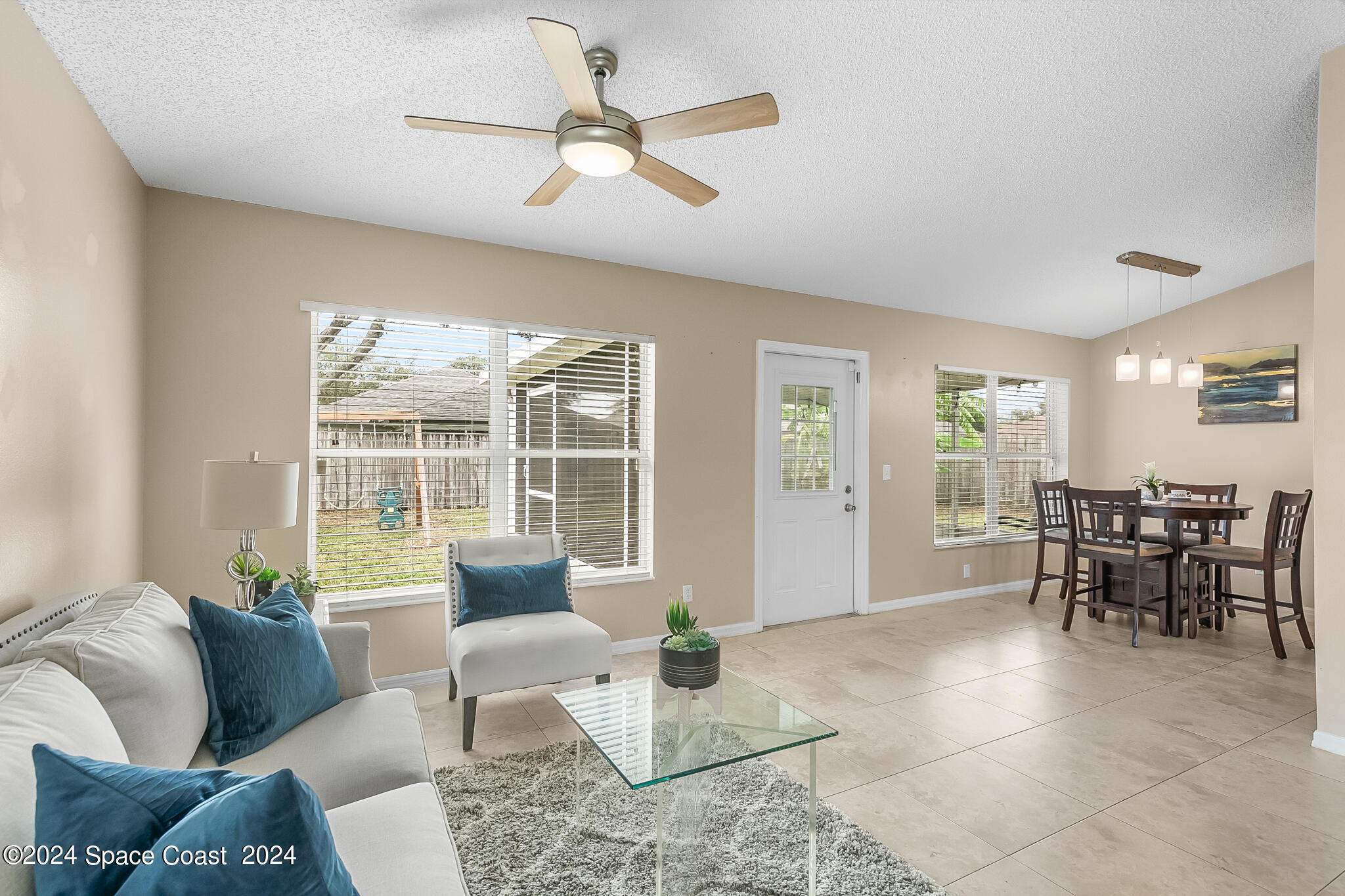 4631 Decatur Circle Melbourne, FL 32934 - Photo 10 of 35 a living room with furniture and a large window