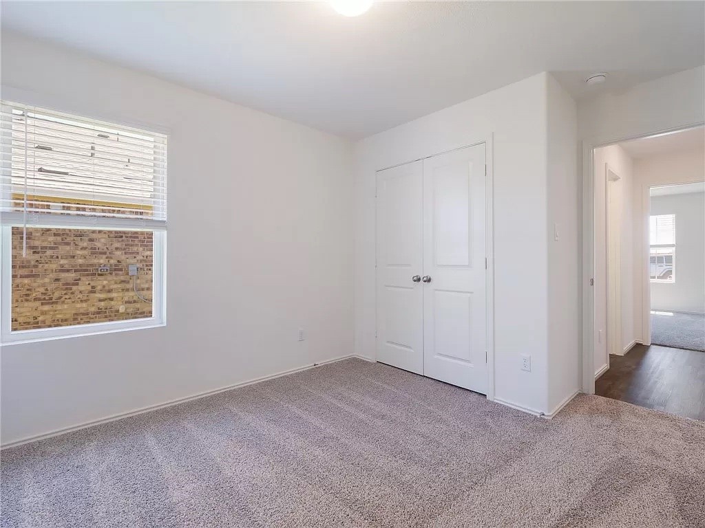 112 Concho Brook Bend Georgetown, TX 78626 - Photo 6 of 20 a view of an empty room with a window