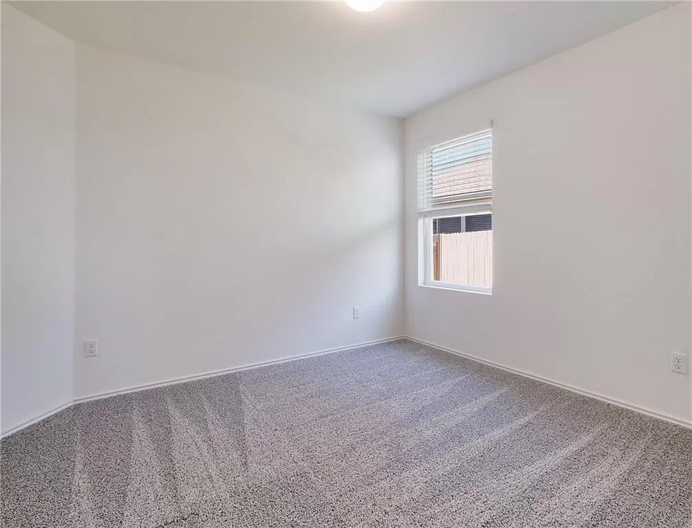 112 Concho Brook Bend Georgetown, TX 78626 - Photo 8 of 20 a view of an empty room with a window