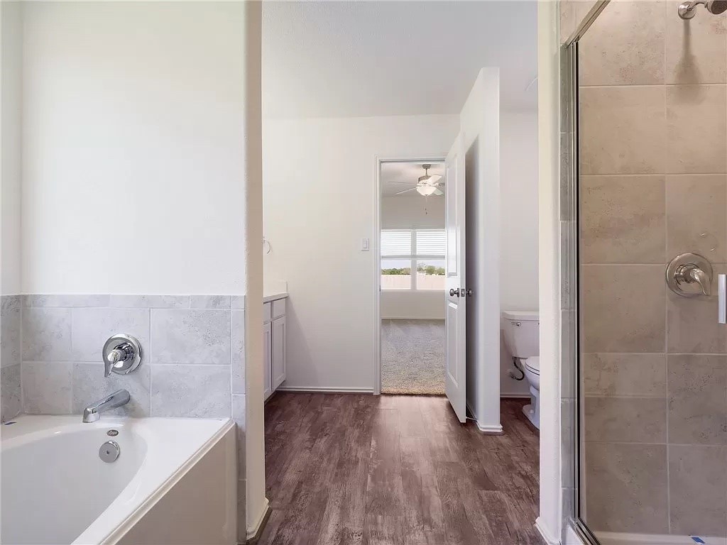 112 Concho Brook Bend Georgetown, TX 78626 - Photo 10 of 20 a bathroom with a bathtub and a sink
