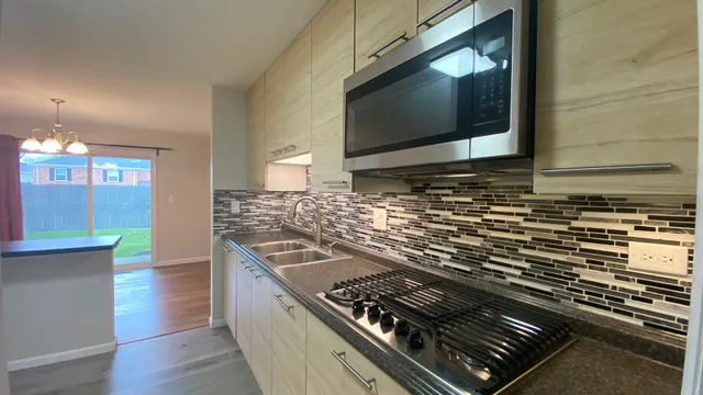 a kitchen with a stove and a microwave