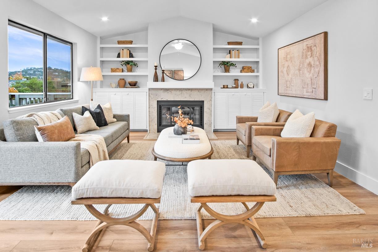 16 Drakes View Circle Greenbrae, CA 94904 - Photo 12 of 45 a living room with furniture fireplace and a large window