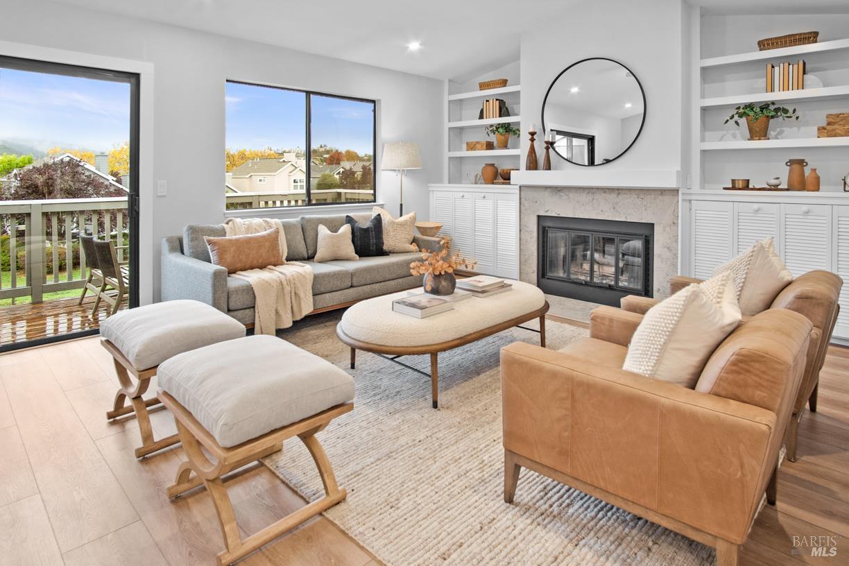 16 Drakes View Circle Greenbrae, CA 94904 - Photo 13 of 45 a living room with furniture and a fireplace