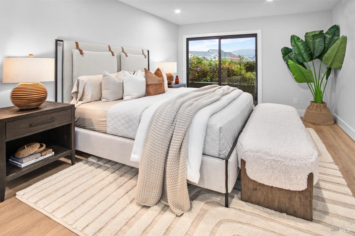 16 Drakes View Circle Greenbrae, CA 94904 - Photo 23 of 45 a bed sitting in a bedroom next to a window