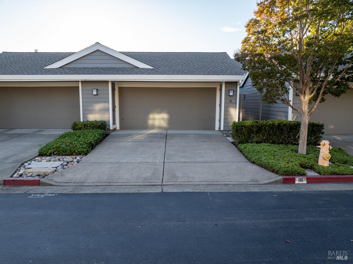 16 Drakes View Circle Greenbrae, CA 94904 - Photo 37 of 45 a front view of a house with a yard and a garage