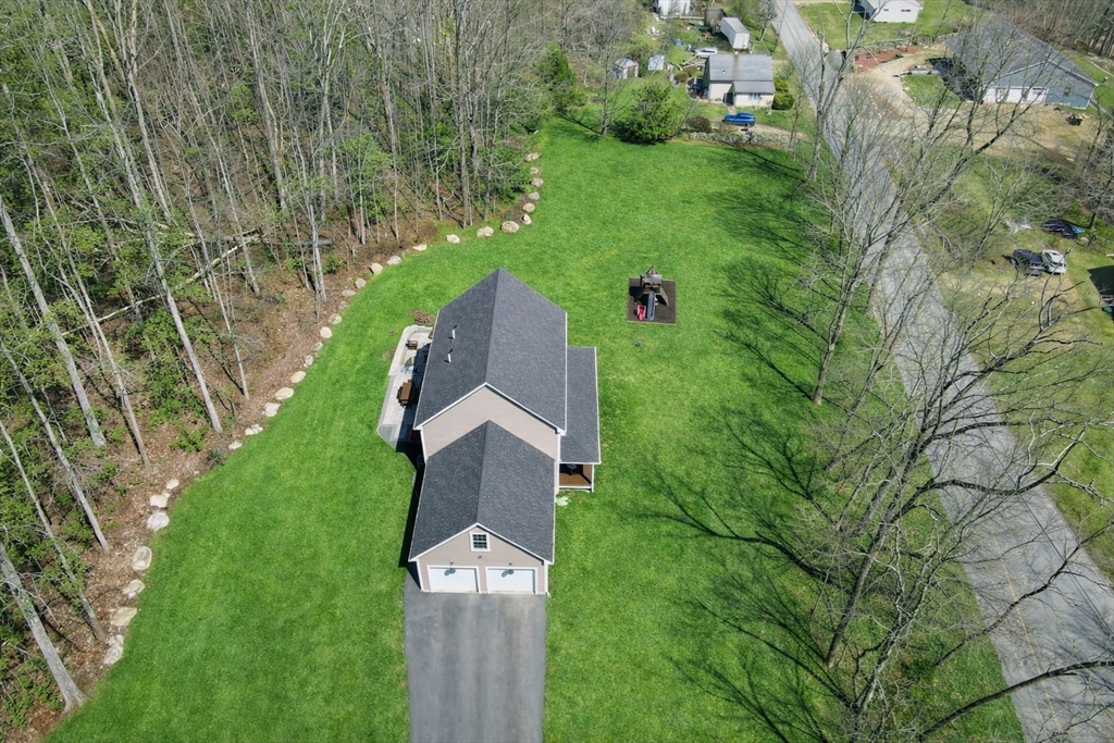 103 Rice Corner Road Brookfield, MA 01506 - Photo 38 of 39 an aerial view of residential house with outdoor space and trees all around
