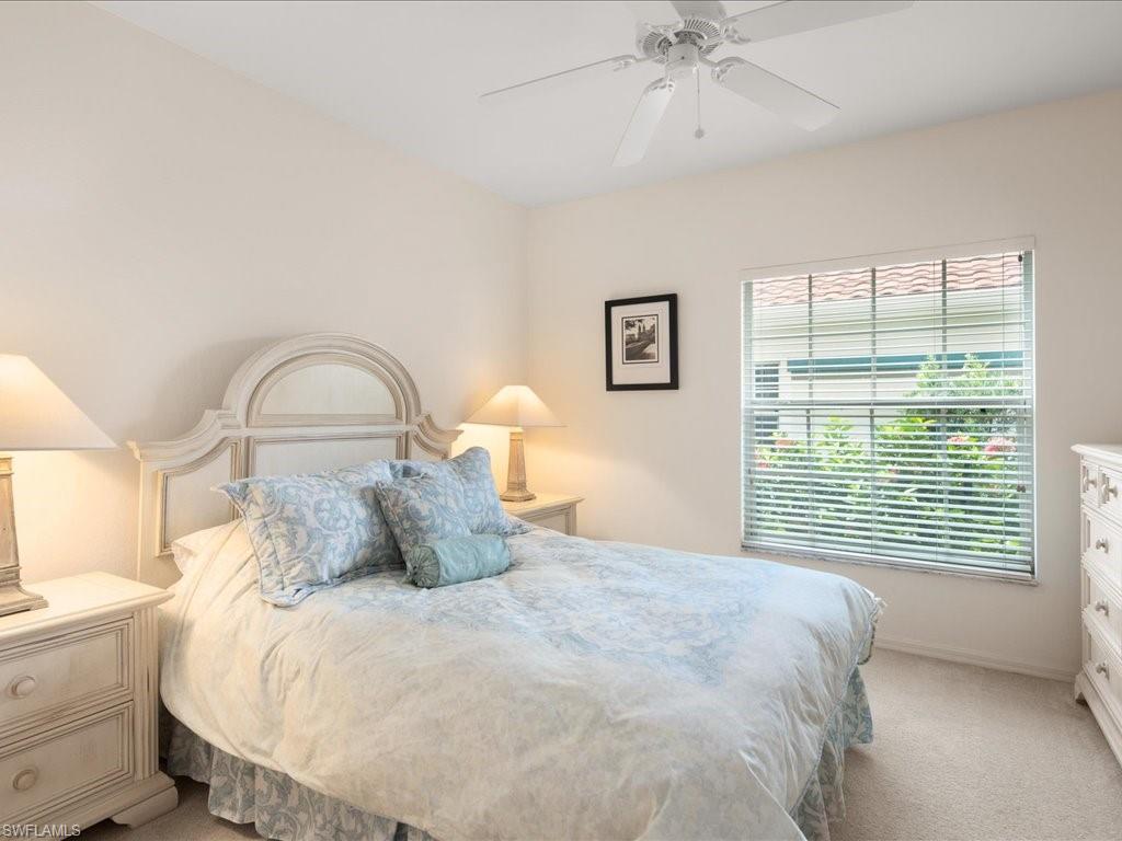 10910 Oak Island Road, Unit 103 Estero, FL 34135 - Photo 13 of 24 a bedroom with a bed and a window