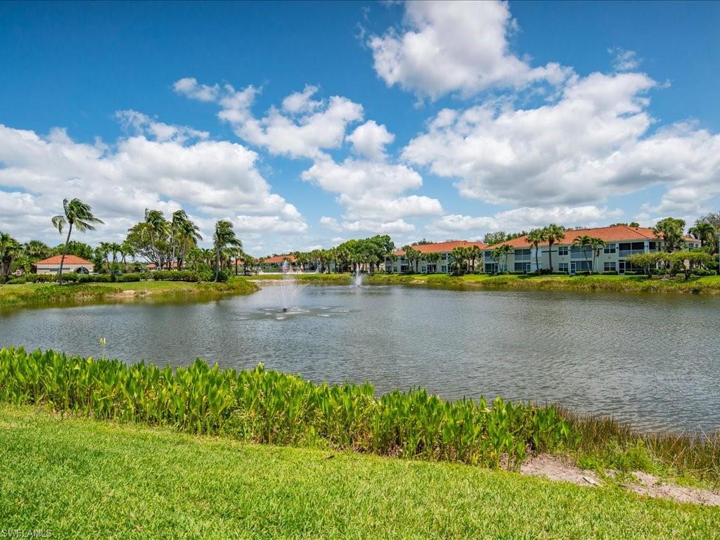 10910 Oak Island Road, Unit 103 Estero, FL 34135 - Photo 19 of 24 a view of a lake with houses in the back