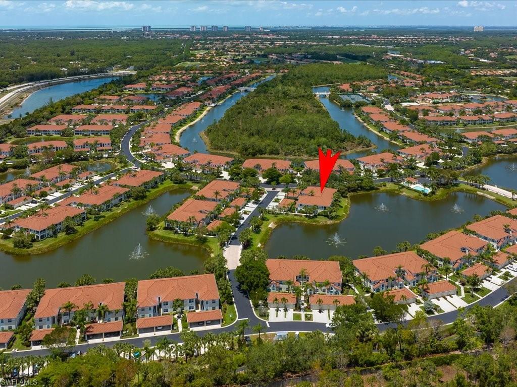 10910 Oak Island Road, Unit 103 Estero, FL 34135 - Photo 2 of 24 an aerial view of residential houses with outdoor space