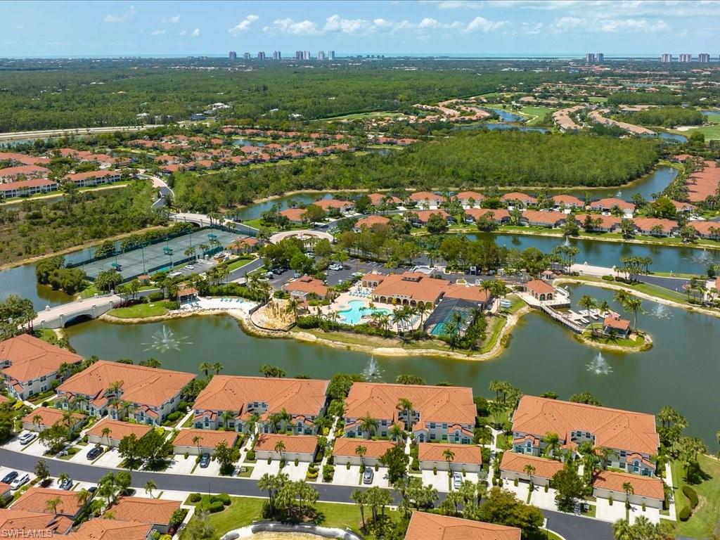 10910 Oak Island Road, Unit 103 Estero, FL 34135 - Photo 21 of 24 an aerial view of ocean and residential houses with outdoor space