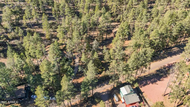 a view of a lush green hillside and a building