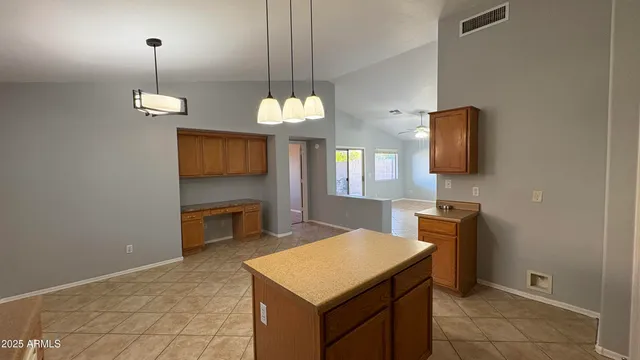a kitchen with a table and chairs in it