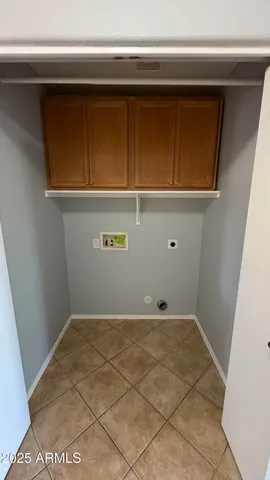 a view of a room with wooden floor and a window
