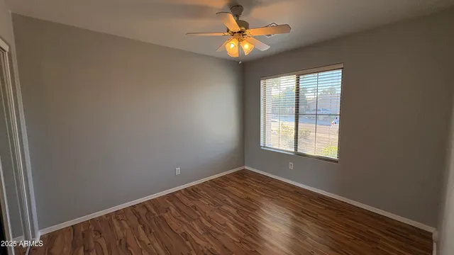 a spacious bathroom with a bathtub shower sink mirror and toilet