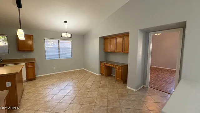 a view of a kitchen with a sink and a fireplace