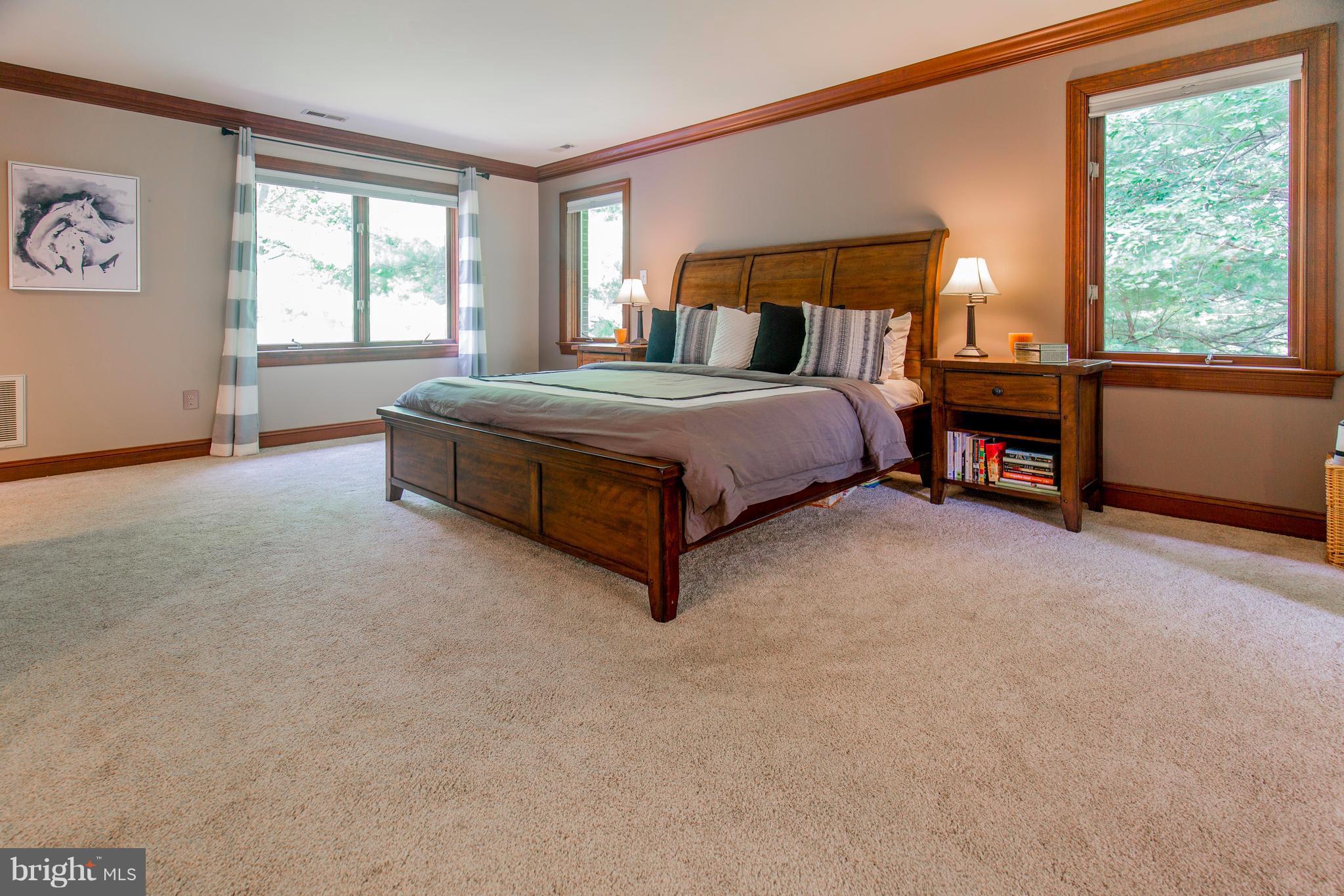610 Bryants Nursery Road Silver Spring, MD 20905 - Photo 16 of 30 a spacious bedroom with a bed and a window