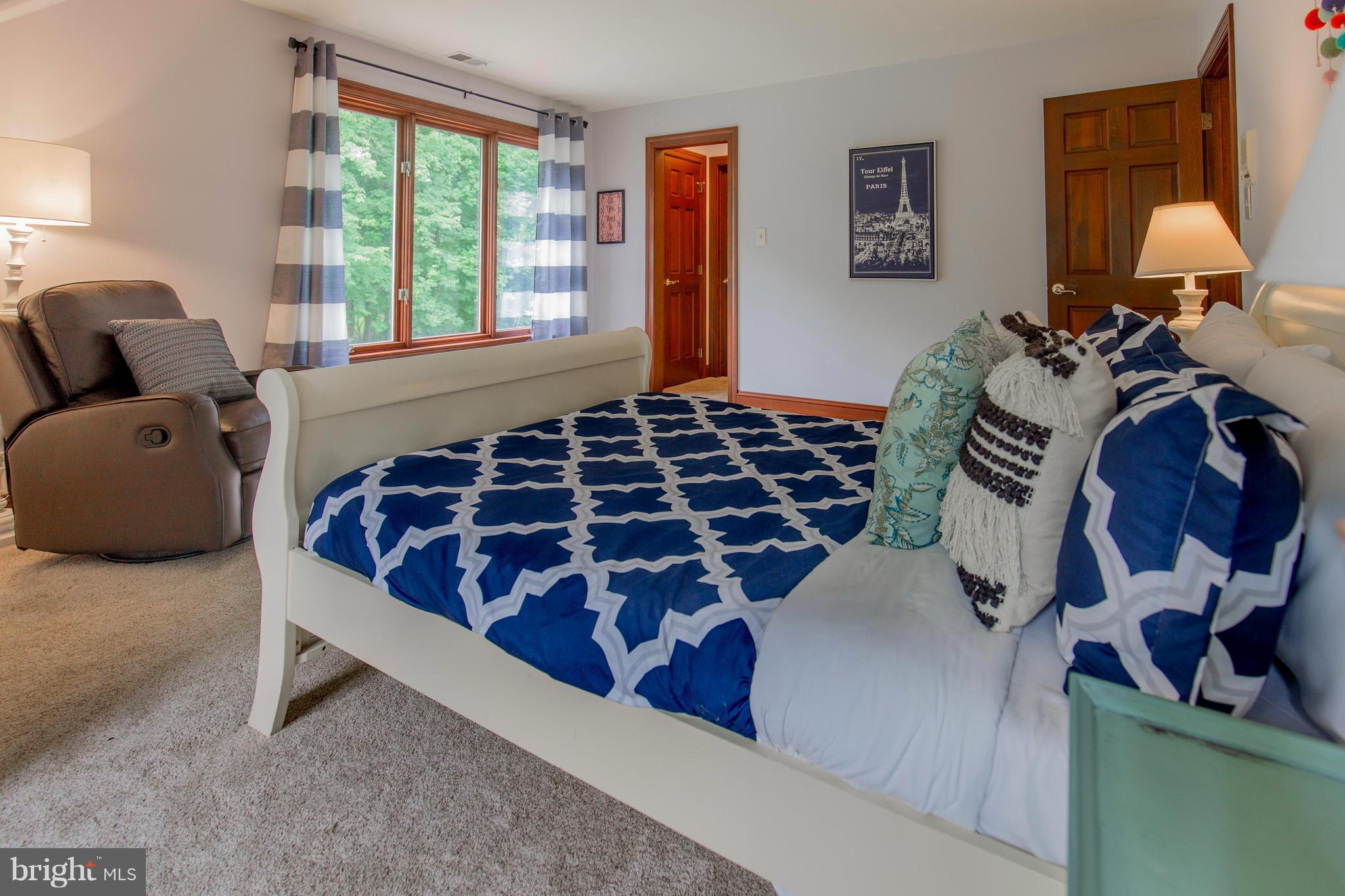 610 Bryants Nursery Road Silver Spring, MD 20905 - Photo 21 of 30 a bedroom with a bed and a window