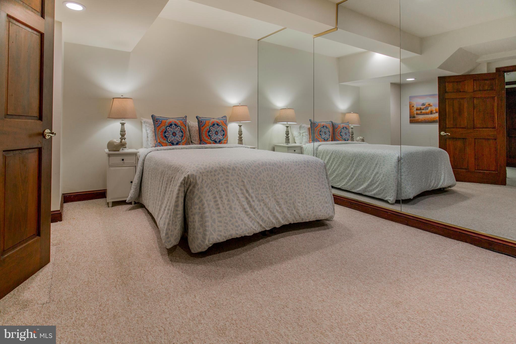 610 Bryants Nursery Road Silver Spring, MD 20905 - Photo 26 of 30 a spacious bedroom with a bed and a walk in closet