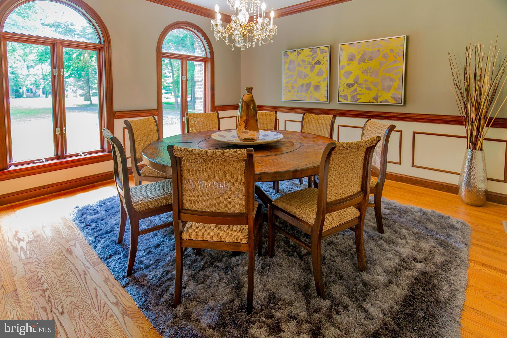610 Bryants Nursery Road Silver Spring, MD 20905 - Photo 10 of 30 a view of a dining room with furniture a chandelier and wooden floor
