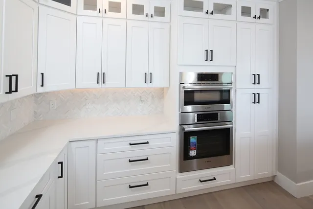 a view of hallway with wooden floor