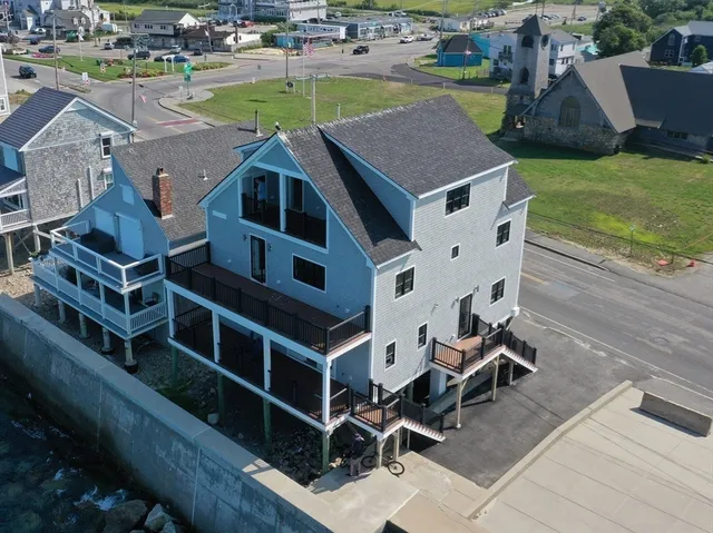 a view of a brick house with many windows
