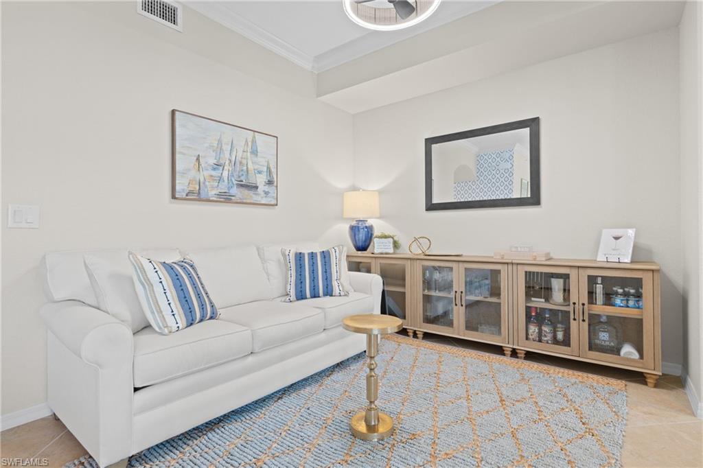 9715 Acqua Court, Unit 116 Naples, FL 34113 - Photo 6 of 43 a living room with furniture