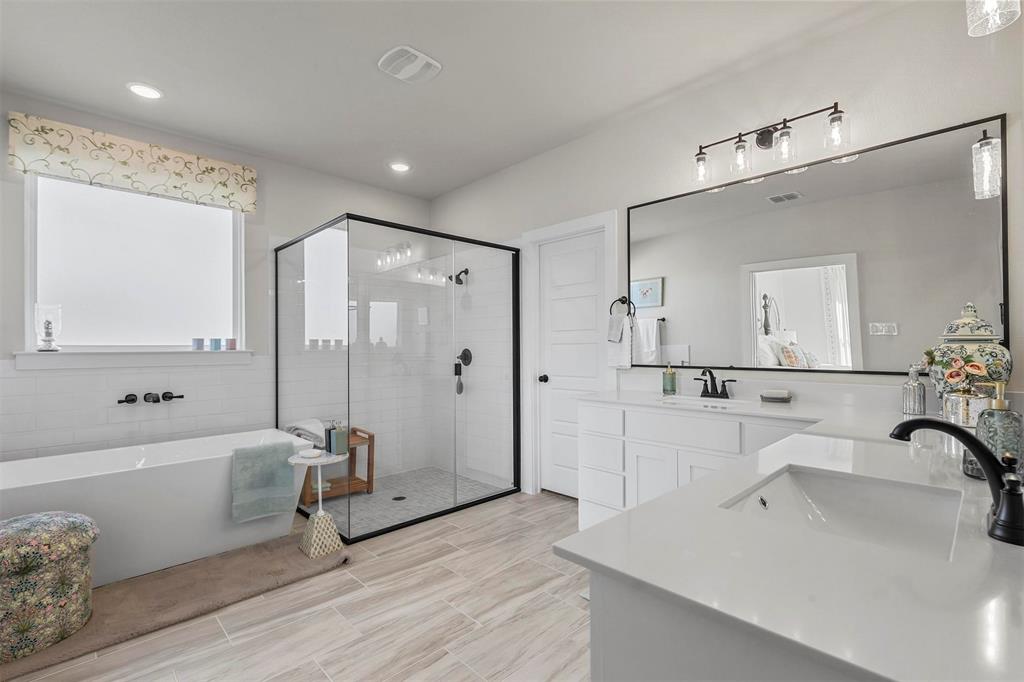 147 Rj Smith Drive Boyd, TX 76023 - Photo 12 of 15 a bathroom with a tub sink shower and mirror