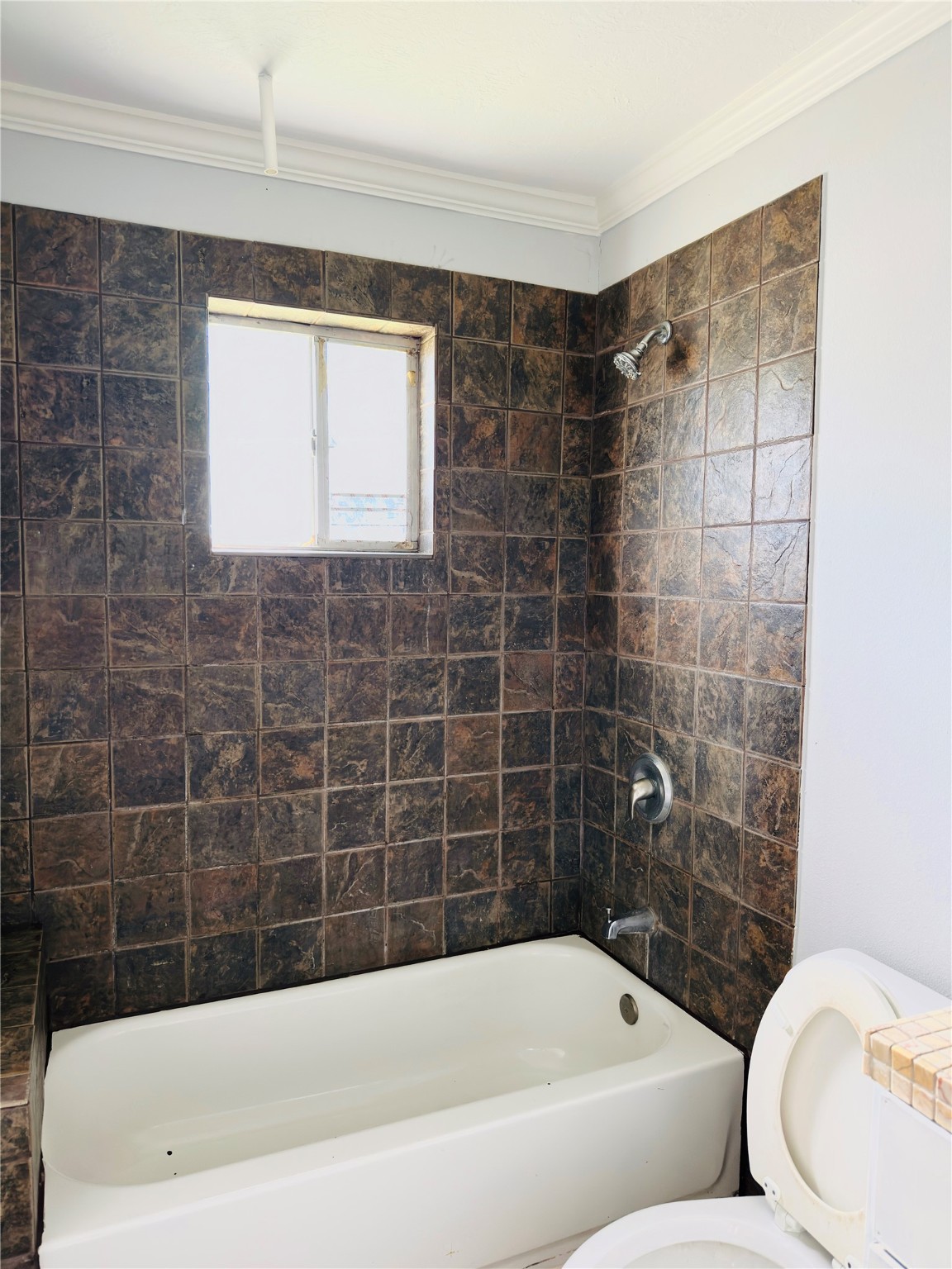 4440 Vivian Road, Unit 4 Houston, TX 77093 - Photo 6 of 6 a bathroom with a bathtub and a shower