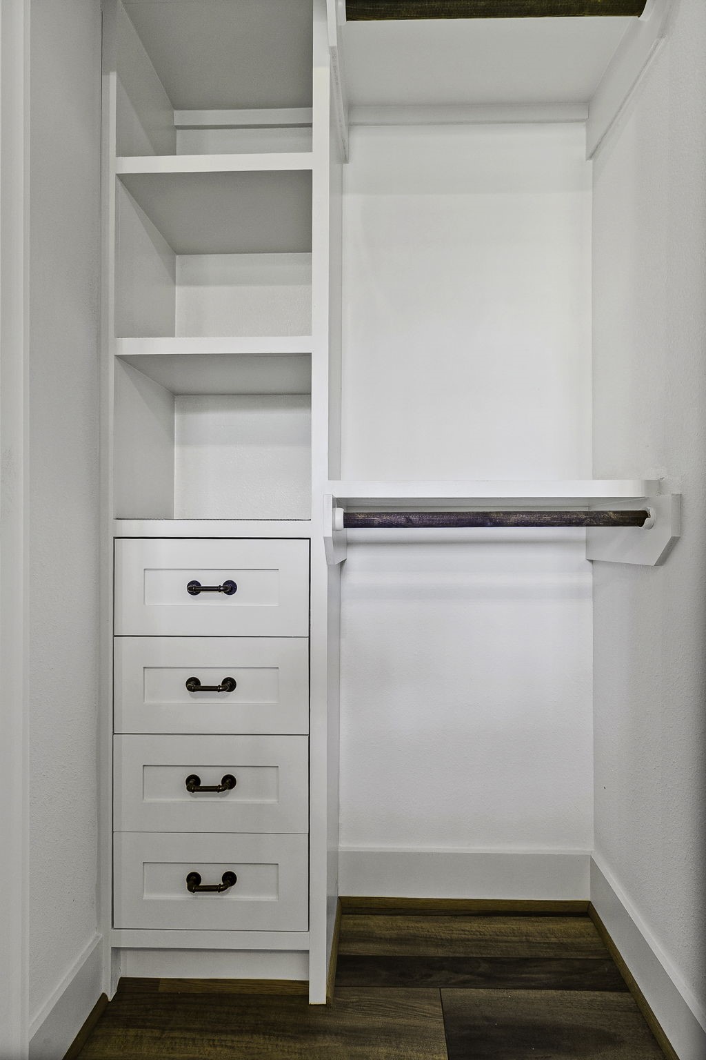 151 Key Largo Loop Point Blank, TX 77364 - Photo 26 of 49 Custom walk-in closet featuring built-in drawers, shelving, and hanging space designed for maximum organization and storage.